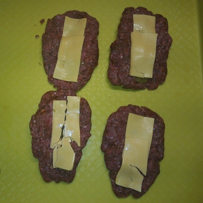 hamburger with sliced pickle, and cheese