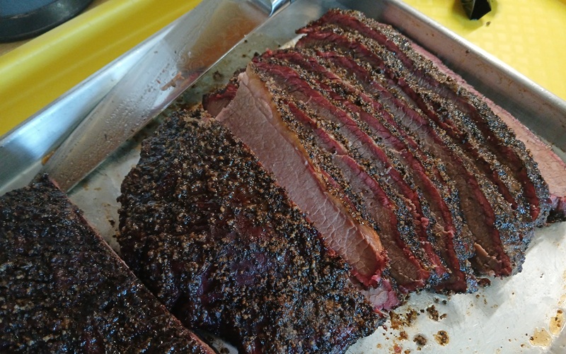 sliced brisket on a cutting board
