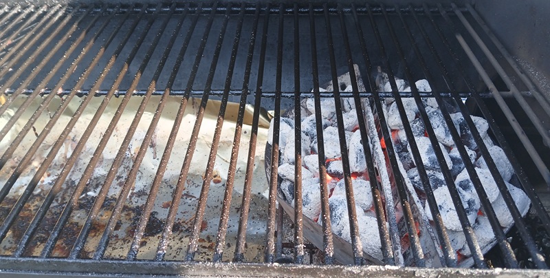 charcoal grill set up for indirect cooking.